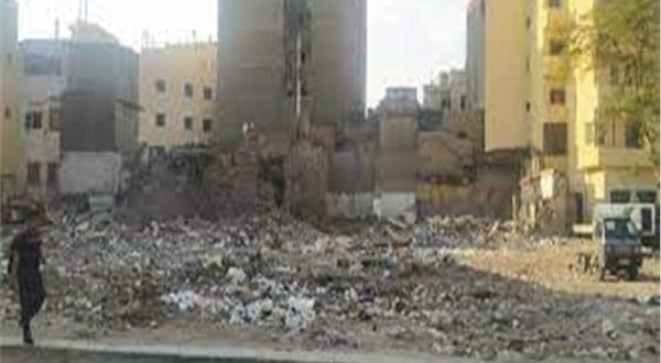 تراكم أكوام القمامة بشارع المعز